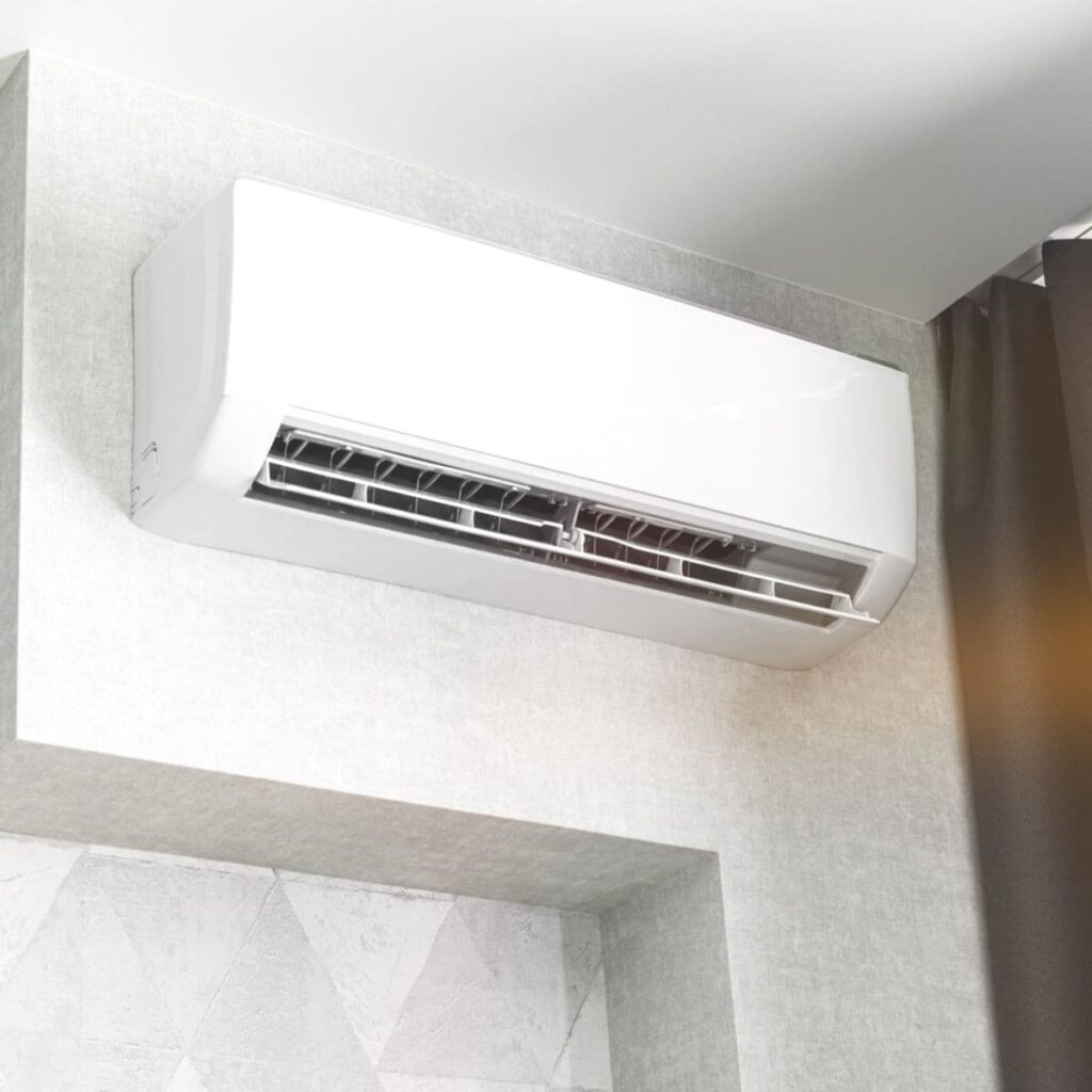 a ductless ac unit installed on an interior wall of a home