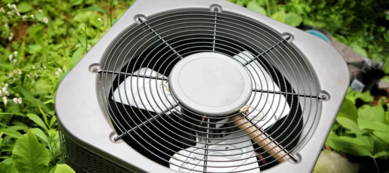 Air conditioning unit on greenery