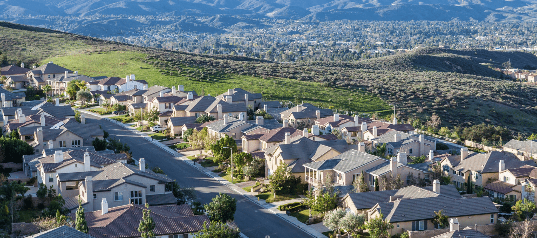 rows of Boerne houses with land in the background