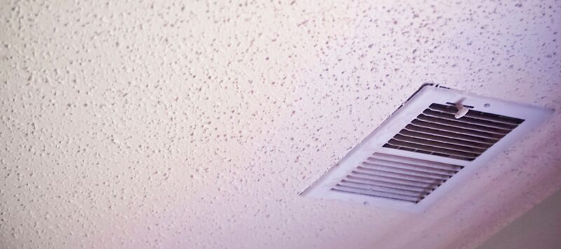 air vent on a ceiling leading to a home's ductwork