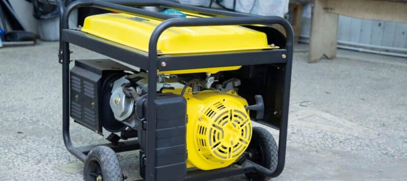 large yellow portable generator sitting outside of a san antonio home