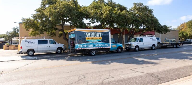 wright ac company truck parked outside of a customers home about to perform services