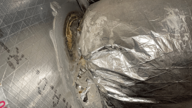 Leaky ductwork disconnected from an HVAC unit.