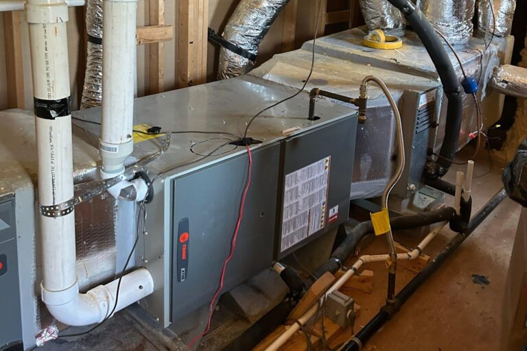 A newly installed horizontal HVAC system in an attic.