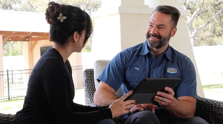 Two people discussing with a tablet.