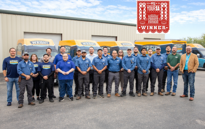 A team photo of the Wright Home Services team with the logo for the YourSA Readers' Choice Awards winner.